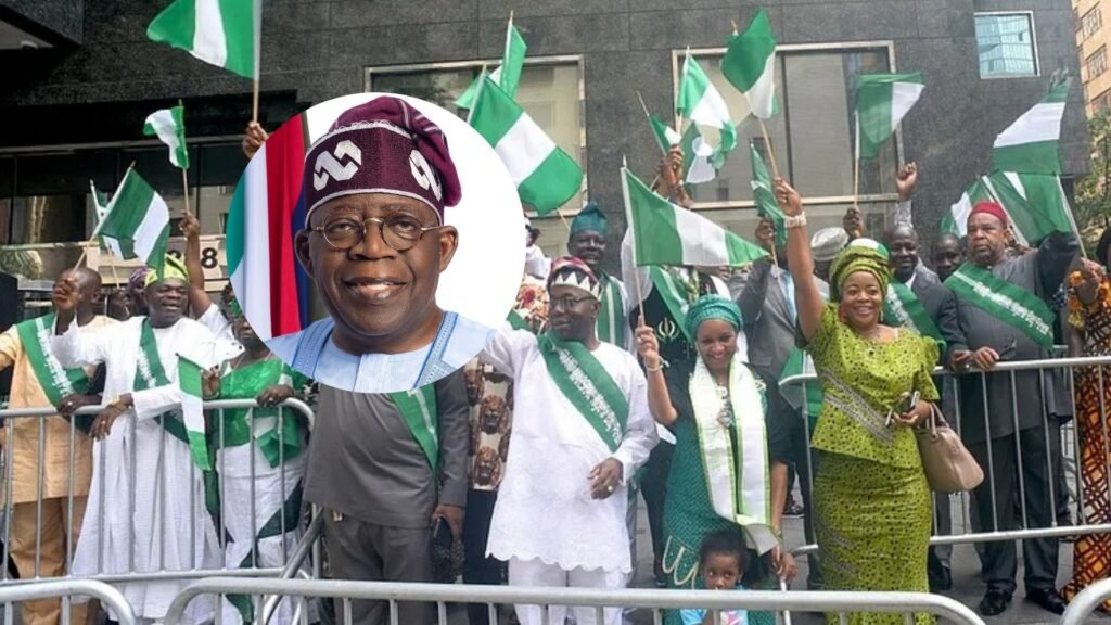 Happy Nigerian people holding their flags.