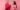 An outraged woman and annoyed man in pink and red sweeaers respectfully