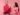 An outraged woman and annoyed man in pink and red sweeaers respectfully