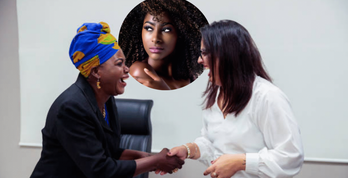 African woman shaking hands with a Indian woman.