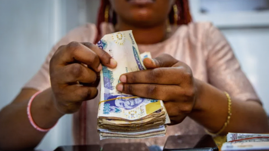 Woman holding Nigerian Naira