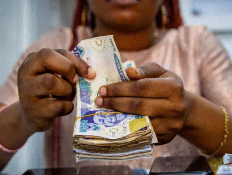 Woman holding Nigerian Naira